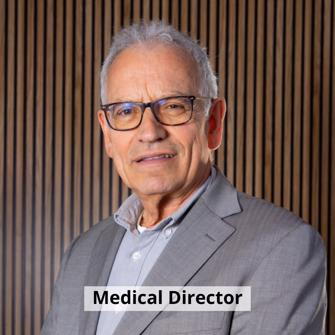 Dr Joan Obiols, psychiatrist and Medical Director of Clínica Synaptica, smiling against wood panelling