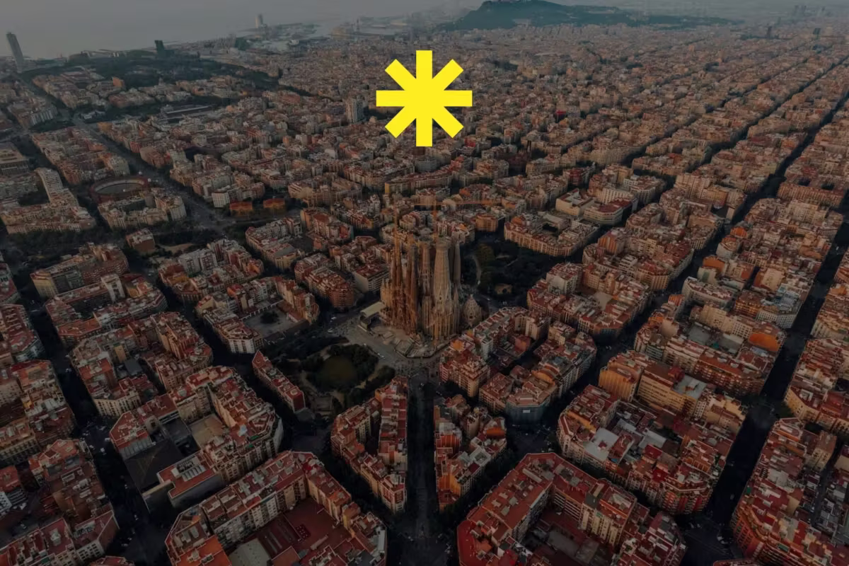 Aerial view of Barcelona with the Sagrada Família and a yellow asterisk